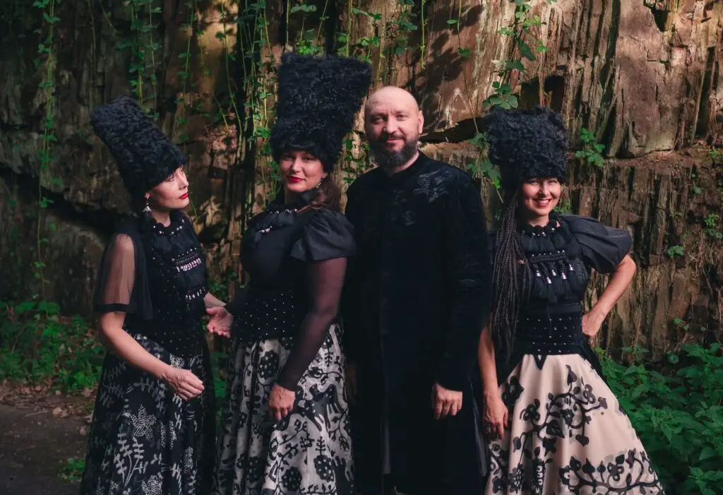 DakhaBrakha quartet in traditional Ukrainian folk costumes, outdoor group photo