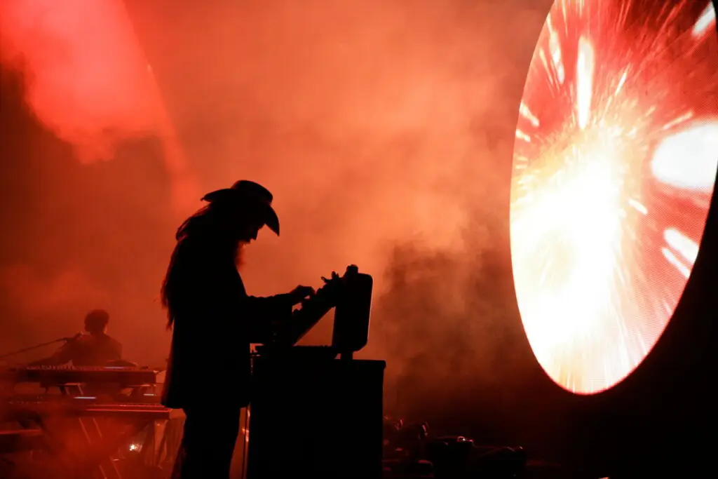 Harry Waters performs in silhouette at keyboard during Roger Waters Presents LEGACY – A Pink Floyd Show