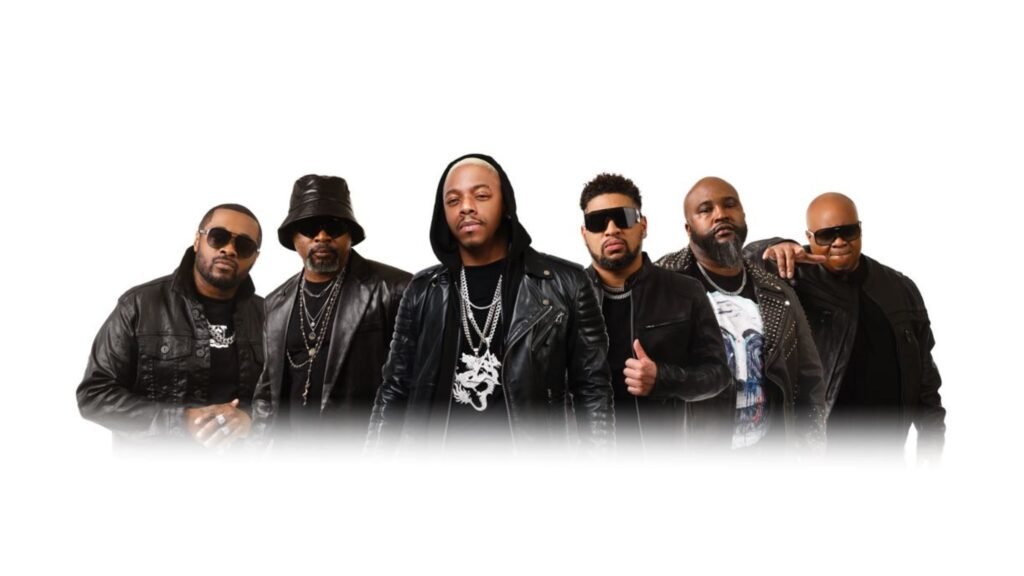Dru Hill R&B vocal group promotional photo — six members in black leather outfits, chains and sunglasses