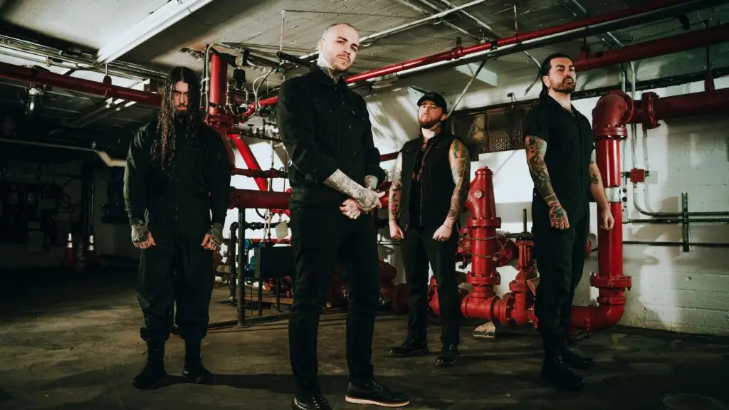 Great American Ghost band promo photo in industrial basement with red pipes